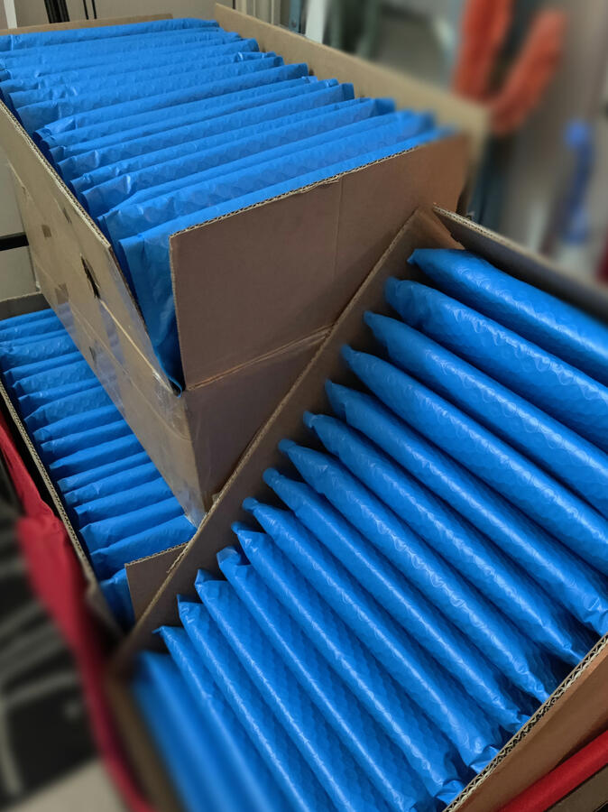 Photo of a wagon full of completed packages ready for pickup.